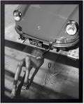 Poster Master Woman Under Classic Car Poster by PosterMaster