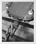 Poster Master Woman Under Classic Car Poster by PosterMaster